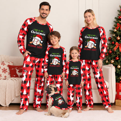 A family of four wearing matching Christmas pajamas stands in a living room with a decorated tree and couch. The set includes long-sleeve shirts and pants in red buffalo plaid with white reindeer and white holiday tree prints, plus black long-sleeve shirts with white reindeer prints and a Christmas graphic.