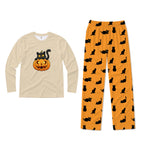 A two-piece kids' pajama set featuring a long-sleeve Cream shirt with a Black cat on a jack-o'-lantern graphic, and matching orange pants with a Black cat silhouette pattern.