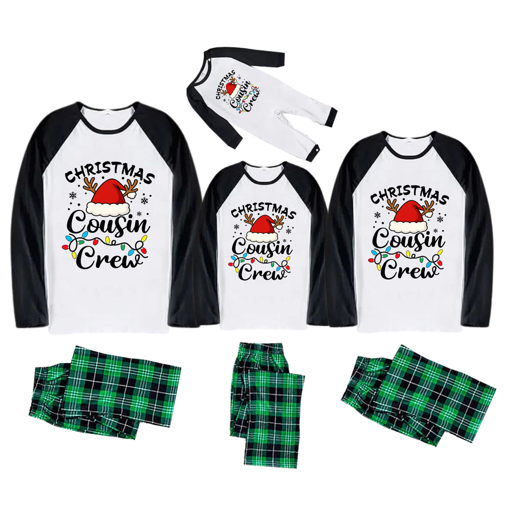 Three matching Christmas cousin crew pajama sets shown on a white background, including long raglan shirts, matching pants, and a pair of socks. The shirts are white with black sleeves and a colorful 'Christmas Cousin Crew' graphic with a Santa hat and holiday lights.