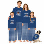 A family of four and a dog wearing matching royal blue long-sleeve pajamas with a snowman graphic and blue plaid pants, posed against a plain white background.