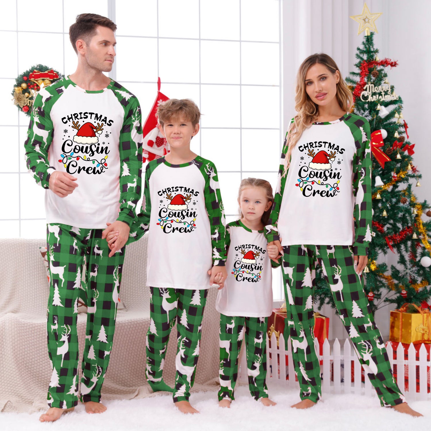 Three matching family Christmas pajama sets in different sizes, featuring cream-colored long-sleeve tops with a black-and-white striped Christmas tree graphic and patterned pants. The pants have holly and pinecone motifs, with the largest set having dark brown pinecones and the smaller sets having dark brown pinecones with green holly accents.