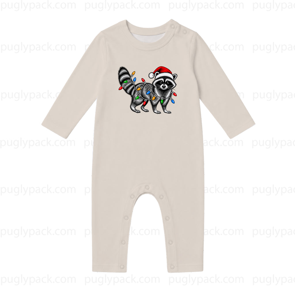 A long-sleeve baby romper in a light oatmeal beige color, featuring a graphic of a raccoon wearing a Santa hat and wrapped in Christmas lights on the chest. The romper has snap closures at the crotch.