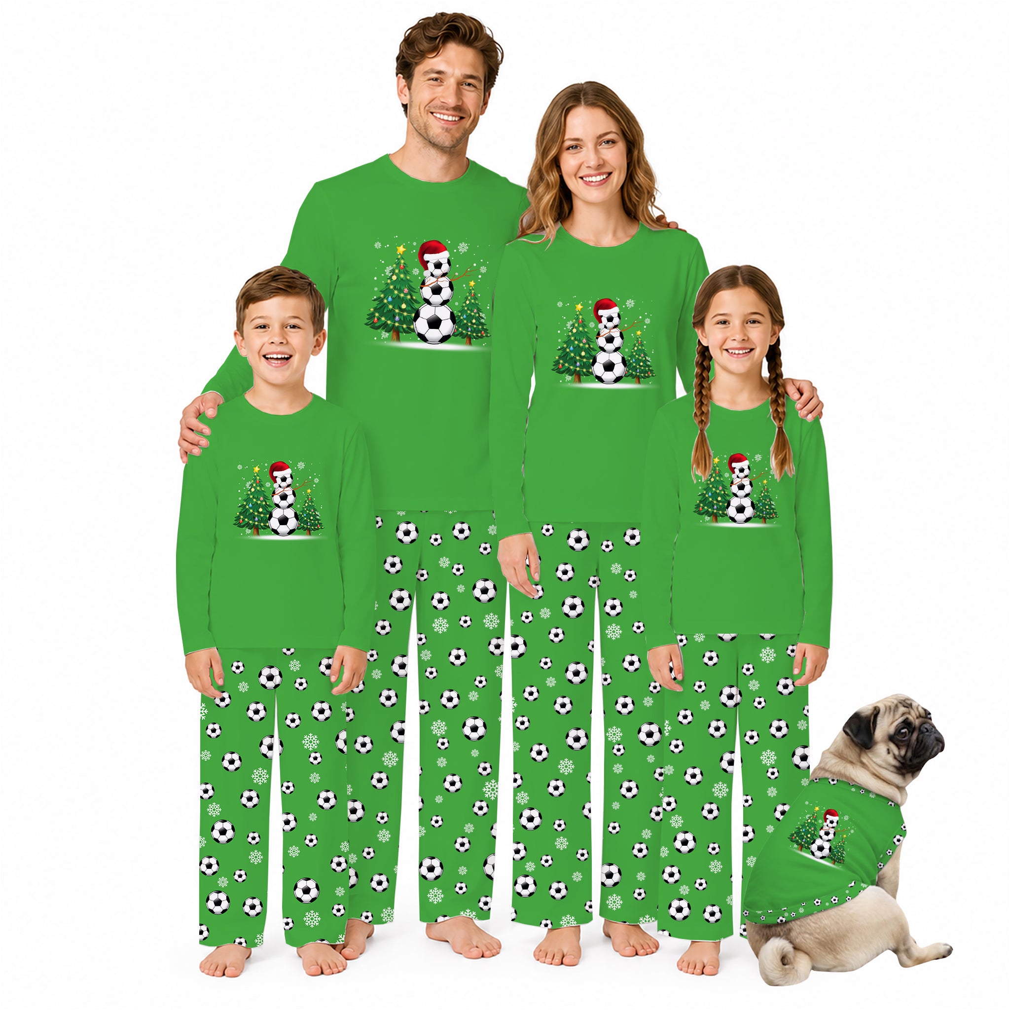 A family of four wearing matching bright green long-sleeve pajamas with a soccer-themed snowman graphic and black-and-white soccer ball prints on the pants, posed against a white background with a small dog in matching pajamas.