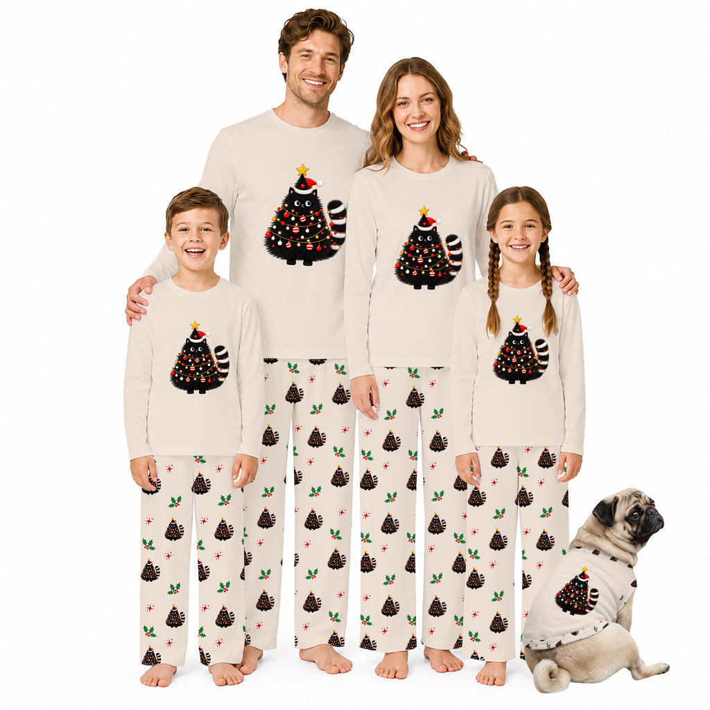 A family of five wearing matching Christmas-themed pajamas stands together on a white background, with a small dog sitting at their right. The pajamas are cream-colored with a black tree graphic decorated with red ornaments, yellow lights, and a green Santa hat, paired with matching patterned pants.