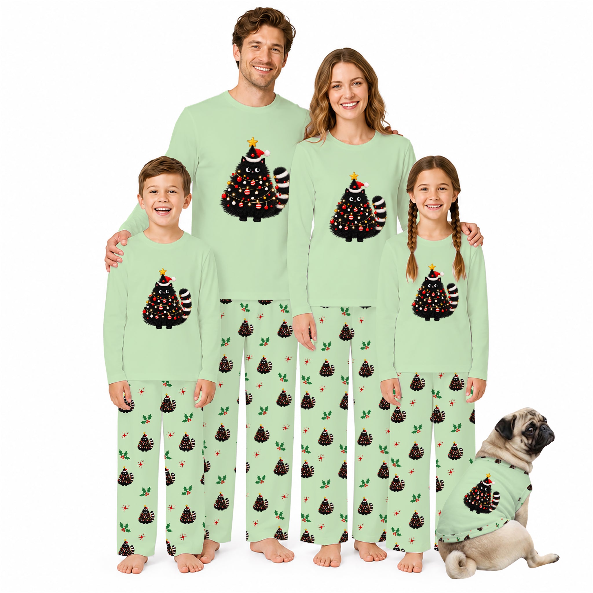 A family of five wearing matching light green Christmas-themed pajamas stands together on a white background, with a small pug dog wearing a matching pajama set beside them. The pajamas feature a black Christmas tree graphic with red ornaments and a striped tail on the chest, and a repeating pattern of dark pine trees with small red and green accents on the pants.