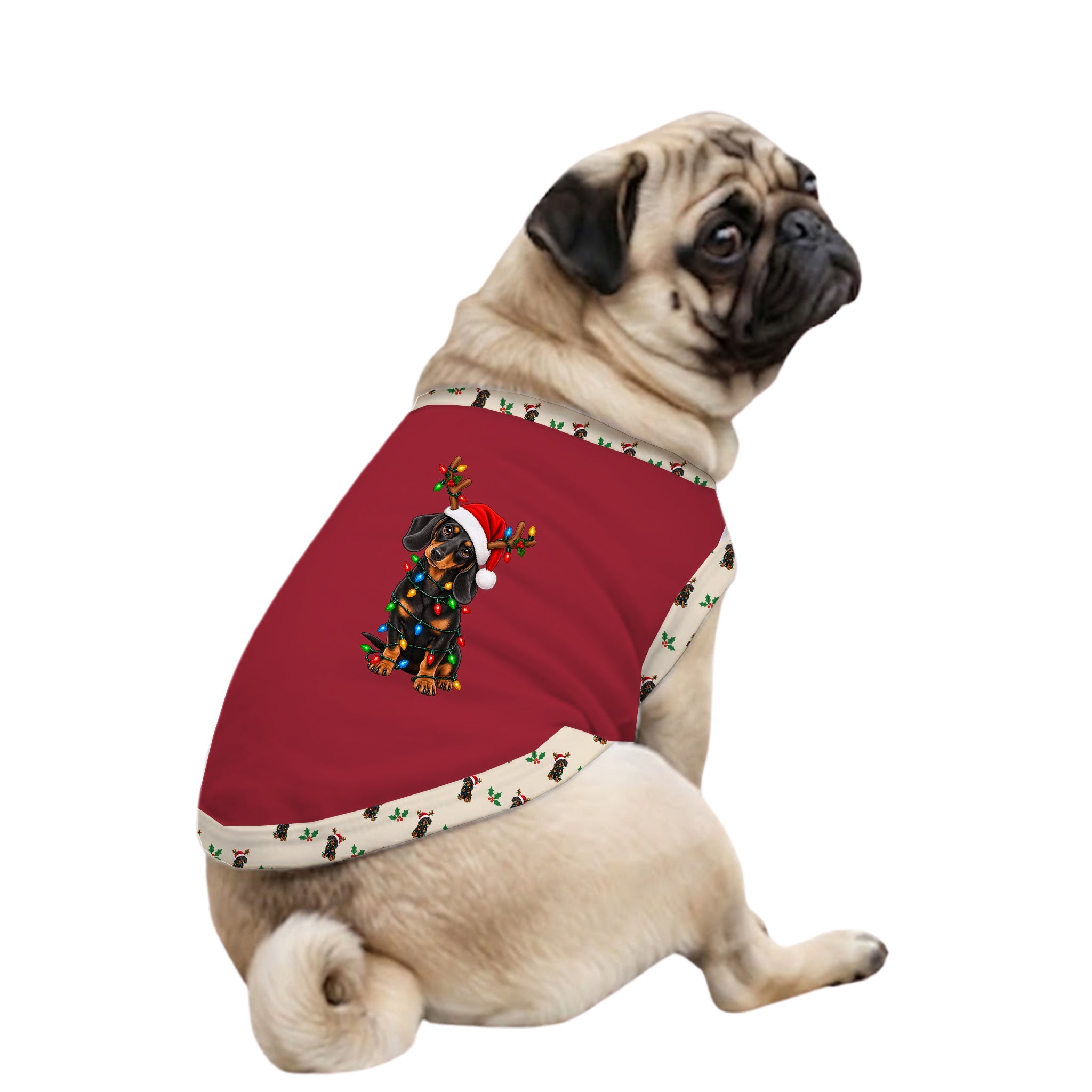 A fawn pug dog wearing a Red Christmas-themed pet sweater with a holiday dog graphic and a Beige patterned trim, set against a plain White background.