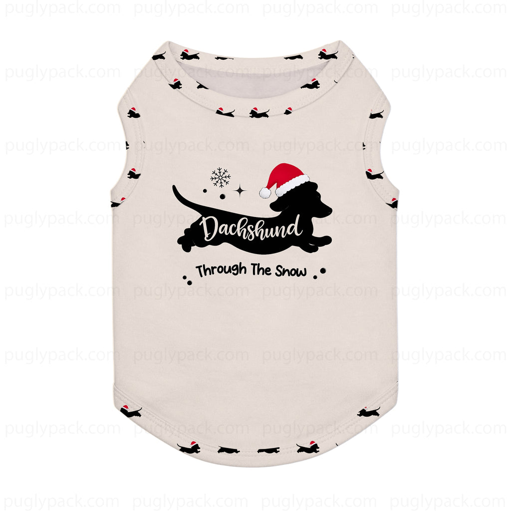 An off-White sleeveless pet shirt featuring a Black silhouette of a dachshund wearing a Red Santa hat, with the text 'Dachshund Through The Snow' and small snowflake details.