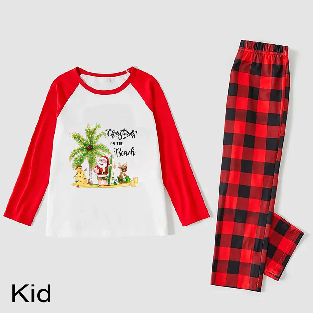 A kids' two-piece pajama set on a light Gray background. The long-sleeve top is White with Red raglan sleeves and a colorful Christmas beach graphic on the front.