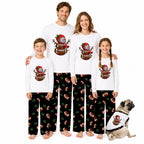A family of four wearing matching white long-sleeve t-shirts and black patterned pajamas, standing together on a white background with a small dog wearing a matching shirt. Each person has a large cartoon football-themed graphic on the front.