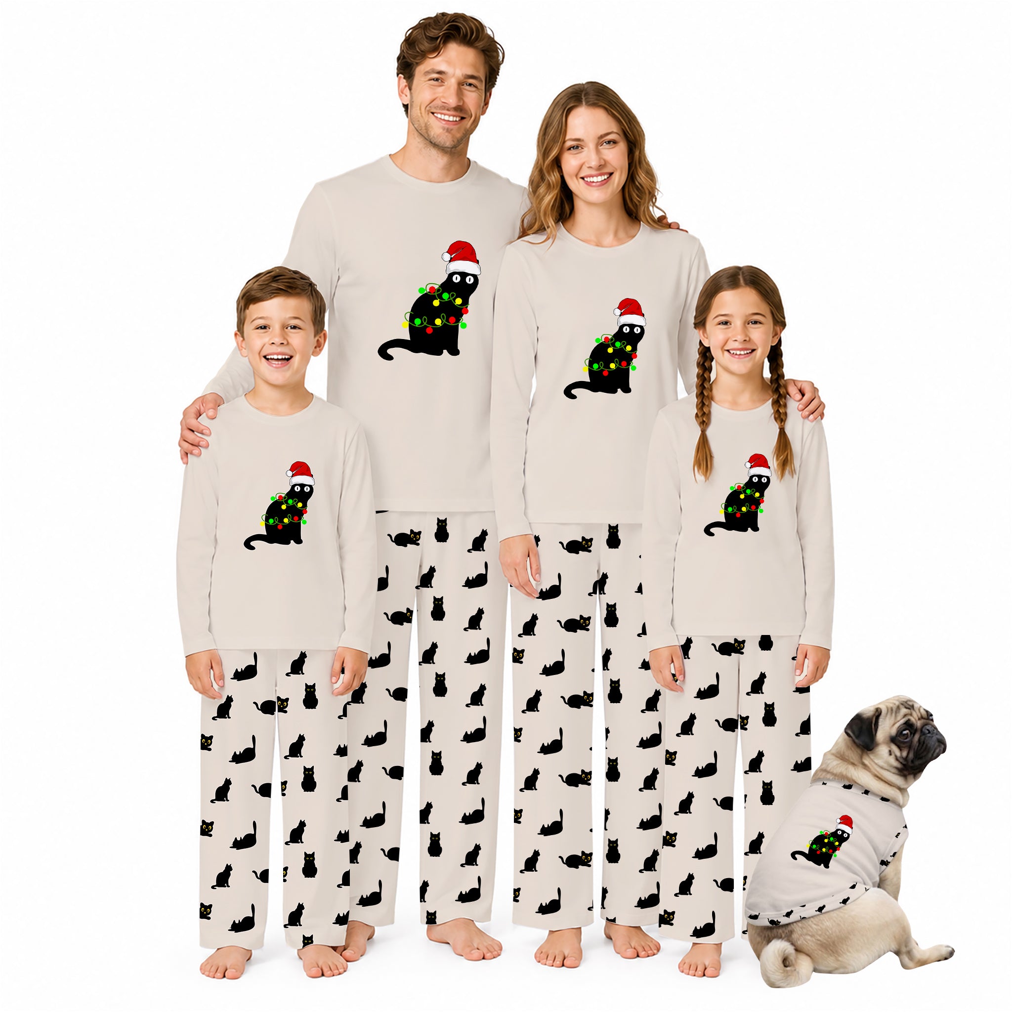 A family of four wearing matching Christmas-themed pajamas stands together on a white background, with a small dog sitting beside them. The pajamas are light beige with black cat silhouettes and a central graphic of a black cat wearing a red Santa hat and green Christmas lights.