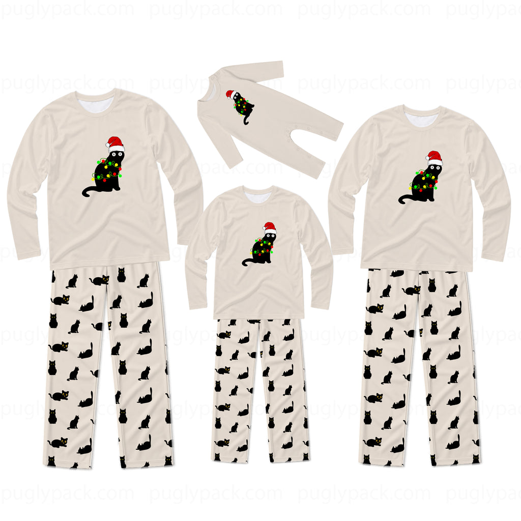 Three sizes of matching family Christmas pajamas shown on a white background, featuring a beige long-sleeve top with a black cat wearing a green Christmas tree and red Santa hat, paired with beige pants patterned with small black cat silhouettes.