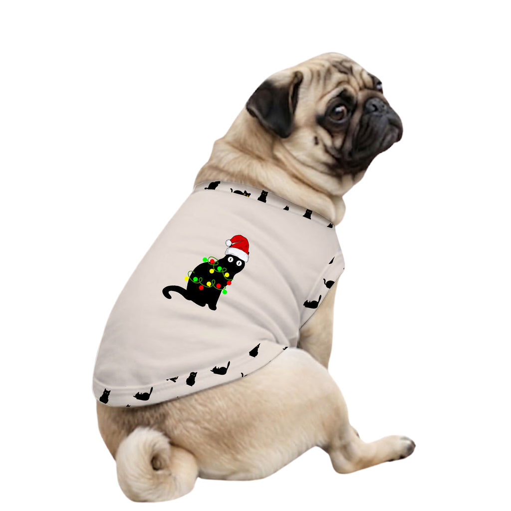 A fawn pug dog wearing a light beige pet sweater with a black cat graphic and a Christmas tree design, set against a plain white background.