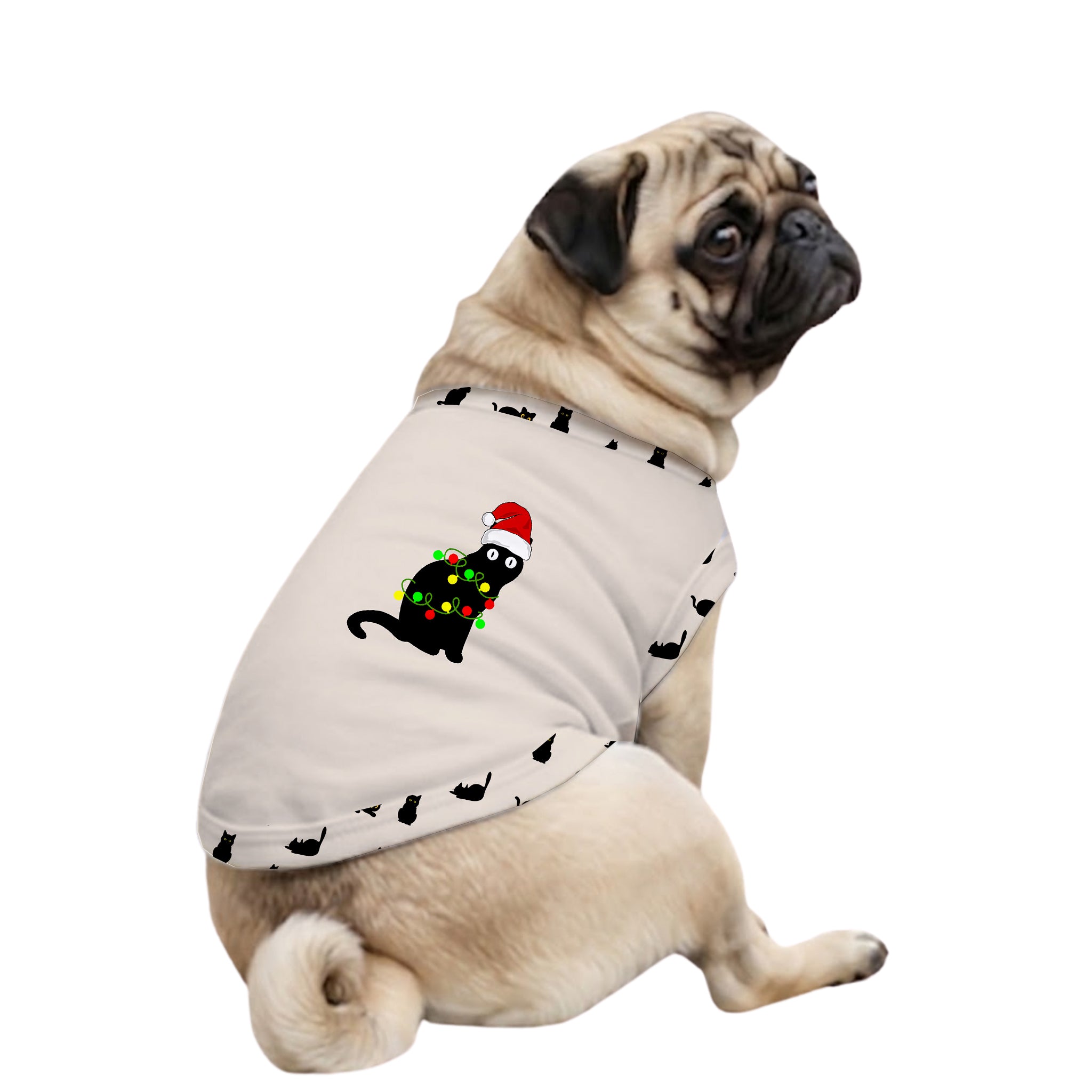 A fawn pug dog wearing a light beige pet sweater with a black cat graphic and a Christmas tree design, set against a plain white background.