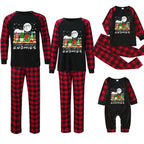 Three sizes of matching Christmas pajama sets shown on a white background: a large adult set, a medium set, and a baby set. Each set includes a black long-sleeve top with red buffalo plaid sleeves and a festive gnome graphic with the text 'MERRY CHRISTMAS ALL THE TIME GNOMIES' on the chest, paired with red and black buffalo plaid pajama pants.
