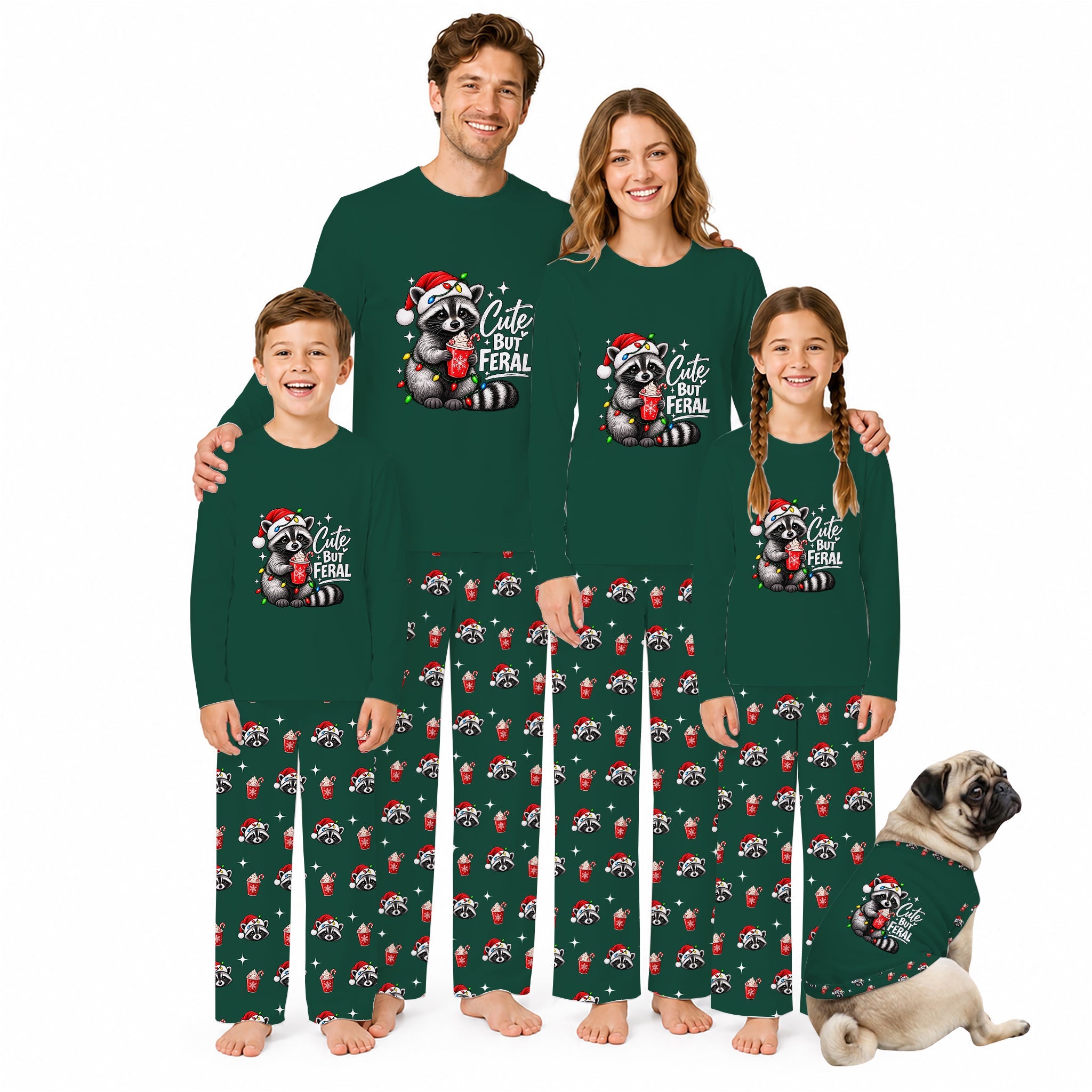 A family of four wearing matching dark green long-sleeve pajamas with a raccoon graphic and 'Cute Feral' text, standing barefoot against a white background, with a small dog sitting beside them in matching pajamas.