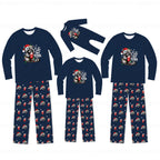 A family matching Christmas pajama set displayed on a white background, including three long-sleeve shirts and three pairs of pants in different sizes. The pajamas are navy blue with a raccoon wearing a Santa hat graphic on the chest and a repeating pattern of Santa hats, gifts, and snowflakes on the pants.