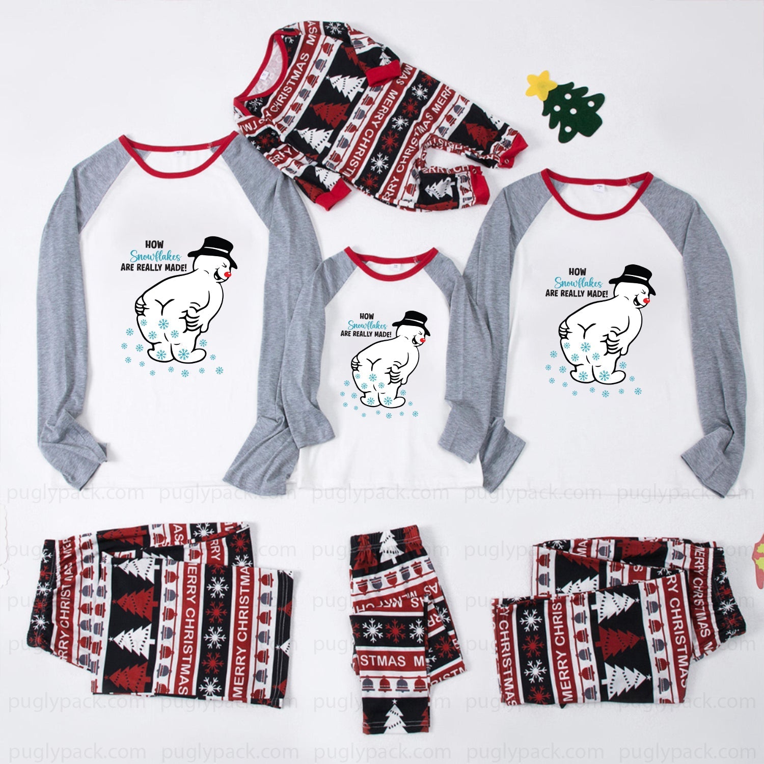 A matching family Christmas pajama set laid out on a White background, including long-sleeve raglan shirts and shorts for multiple sizes, plus a matching hat. The shirts are White with Gray sleeves and Red trim, featuring a cartoon polar bear graphic and text.