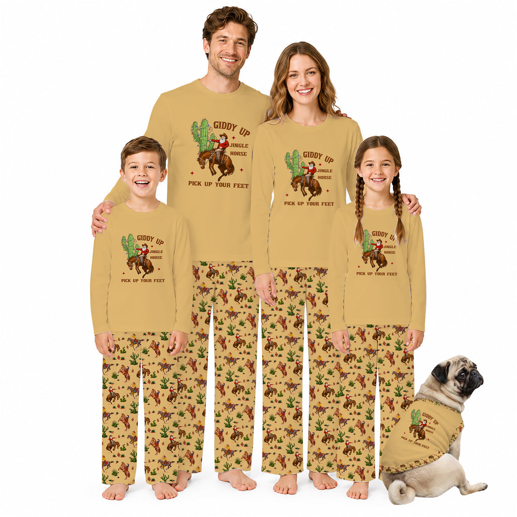 A family of four and a dog wearing matching tan and brown western-print pajamas with a cowboy riding a cactus graphic and the text 'Giddy Up Pick Up Your Feet' on a white background.
