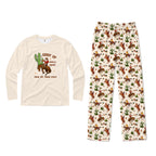 A two-piece kids' pajama set featuring a long-sleeve cream shirt with a western 'Giddy Up Jingle Horse' graphic and matching cream pants with an all-over cowboy and cactus print.