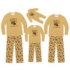 A matching family pajama set displayed on invisible mannequins, featuring three sizes of long-sleeve shirts and pants. The pajamas are a sandy tan color with a graphic of a cowboy riding a horse with a cactus and the text 'GODDY TIP PICK UP YOUR FEET'.