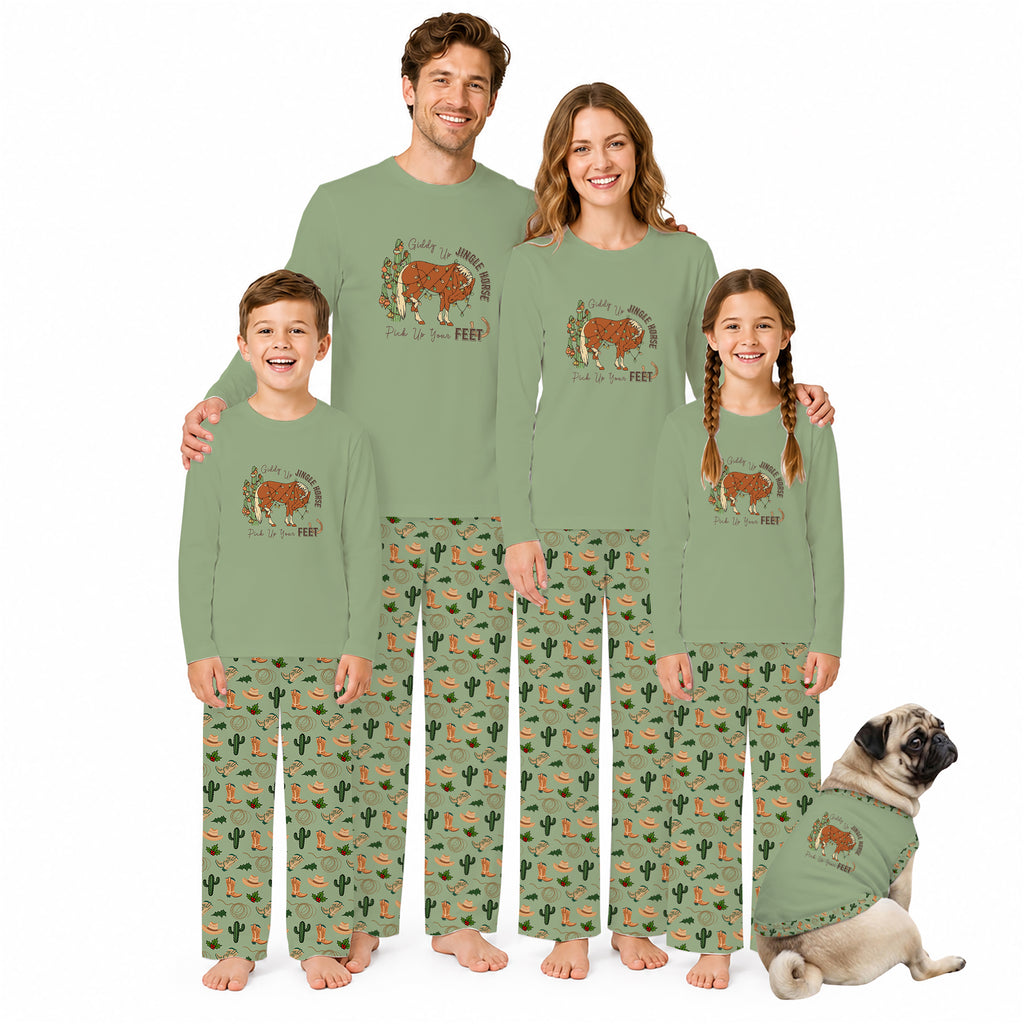 A family of four wearing matching sage green long-sleeve pajamas with a brown bear graphic on the chest and green cactus-print pants, standing together on a white background with a small pug dog wearing a matching pajama set.