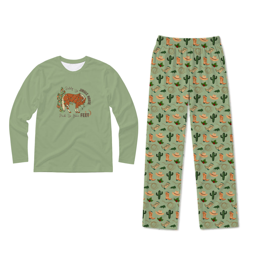 A two-piece kids' pajama set on a plain white background. The long-sleeve shirt is sage green with a graphic of a steer and the text 'Stay in the woods when you can, feed to your feet'.