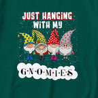 A dark Green t-shirt featuring a festive graphic print of four cartoon garden gnomes under the text 'JUST HANGING WITH MY GNOMIES' on a White cloud shape.