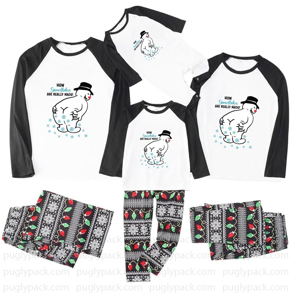 A matching family pajama set displayed on a White background, including three raglan long-sleeve shirts and three matching patterned pants. The shirts are White with Black sleeves and a cartoon penguin graphic with the text 'HOW Grandpa's ARE HEALTHY MAN!'.