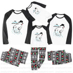 A matching family pajama set displayed on a White background, including three raglan long-sleeve shirts and three matching patterned pants. The shirts are White with Black sleeves and a cartoon penguin graphic with the text 'HOW Grandpa's ARE HEALTHY MAN!'.