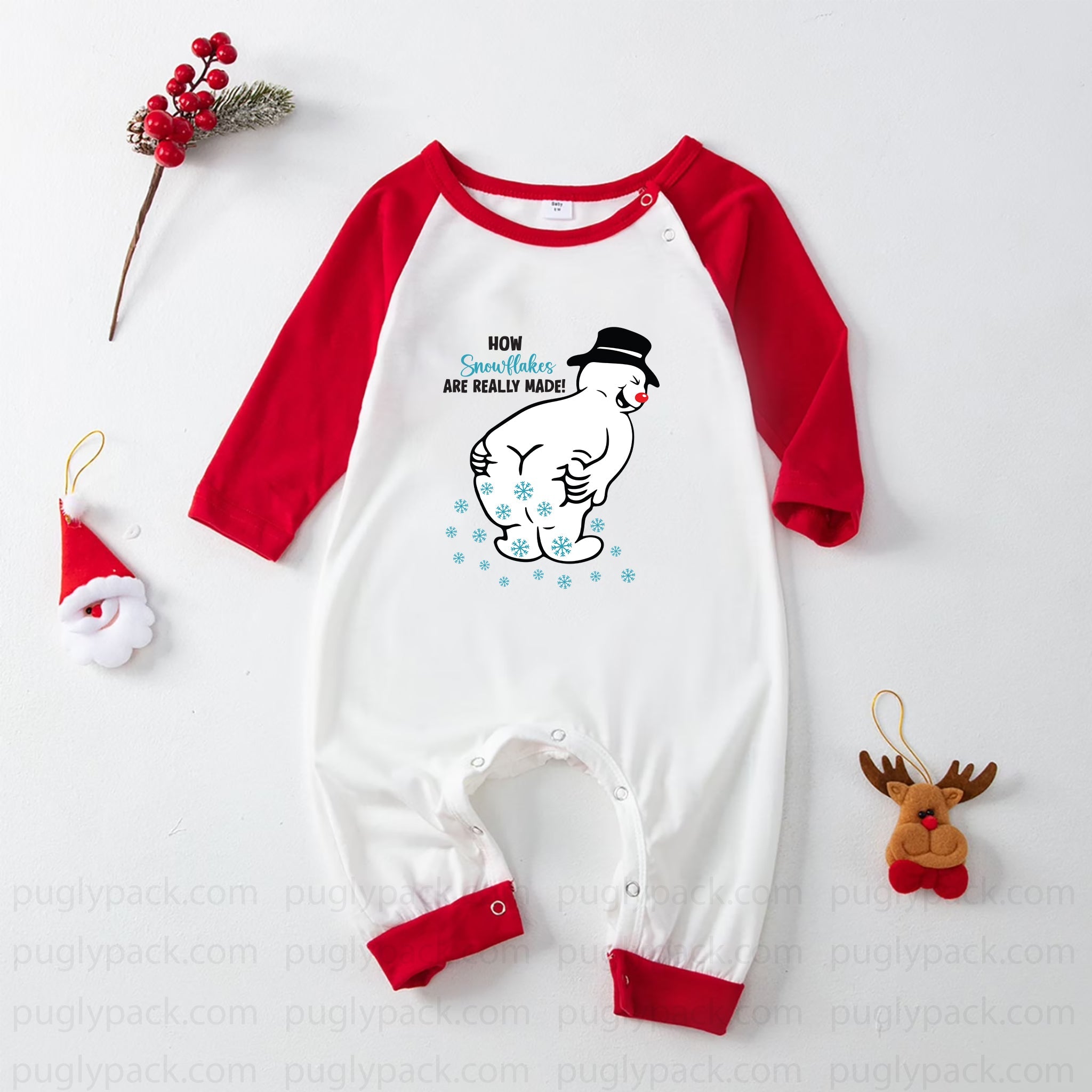 A baby long-sleeve romper with Red raglan sleeves and cuffs, featuring a cartoon snowman graphic on the chest with the text 'NOW Someone is REALLY MAD!'. The romper is laid flat on a White background with Christmas-themed decorative props.