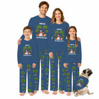 A family of four and a dog wearing matching custom long-sleeve pajamas with a blue base, green palm tree print, and a cartoon penguin graphic. The pajamas are personalized with the name 'MELE' and Hawaiian text.