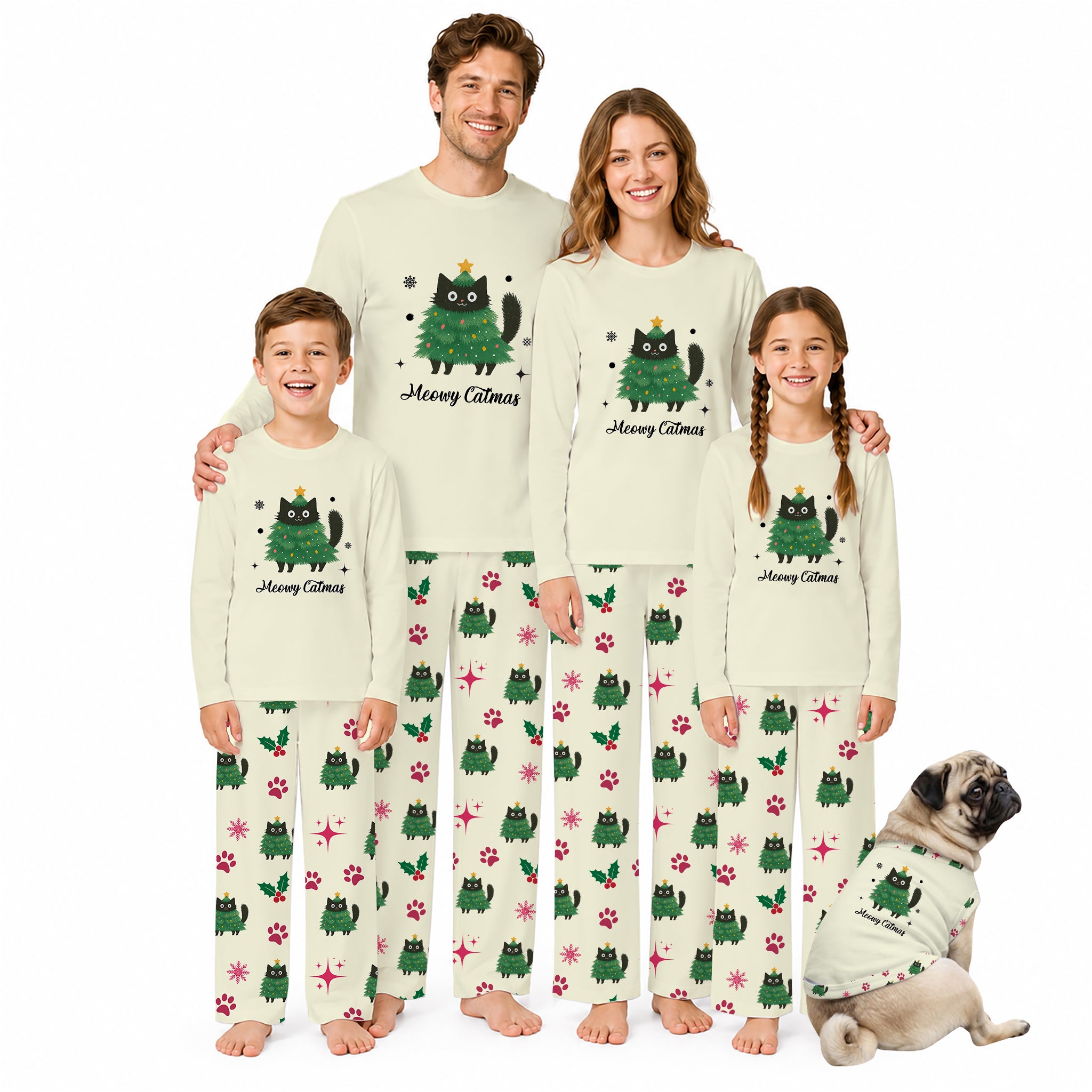 A family of four and a dog wearing matching Christmas-themed pajamas against a plain White background. The pajamas are Cream-coloRed with a Green cat graphic and the text 'Merry Catmas', and the pants feature a pattern of Green cats, paw prints, and Red snowflakes.