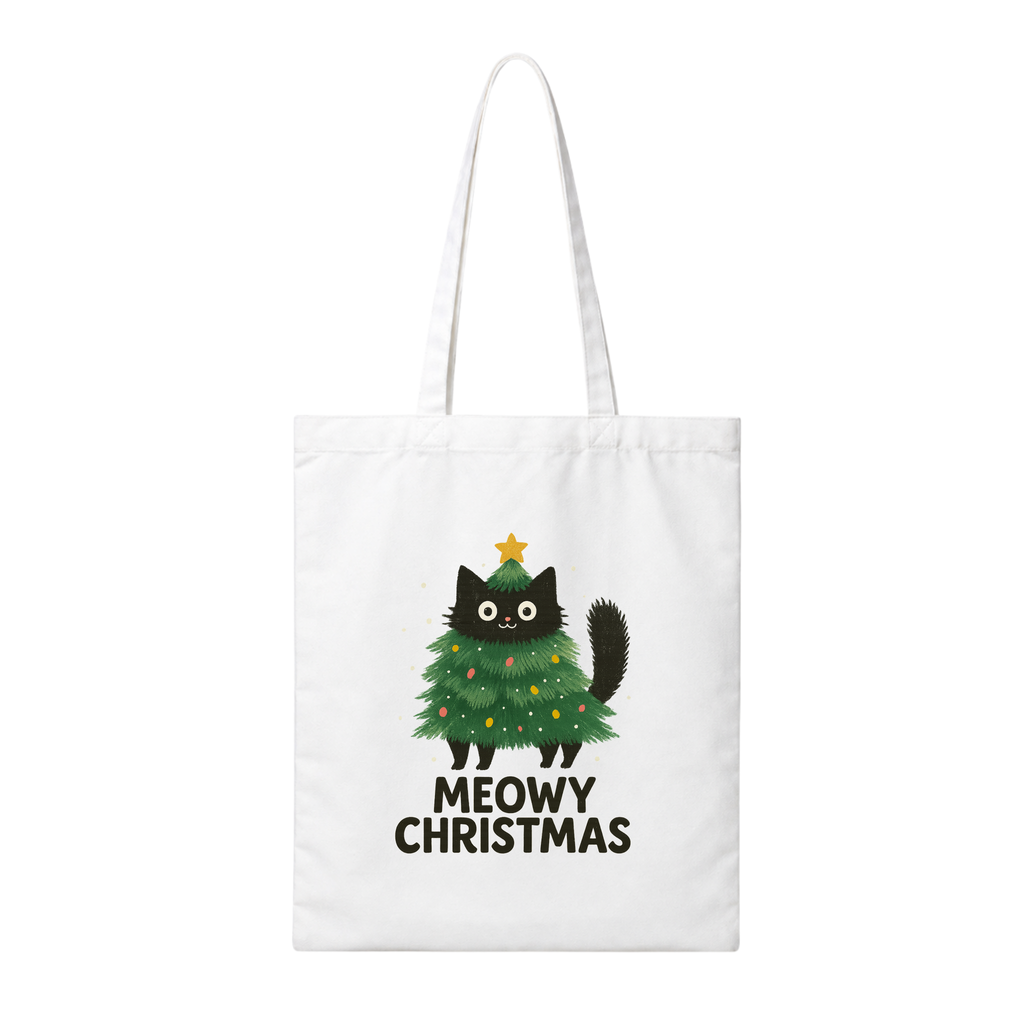A white canvas tote bag with long handles, featuring a graphic of a black cat dressed as a green Christmas tree with a gold star and the text 'MEOWY CHRISTMAS' printed below.