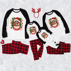A coordinated Christmas pajama set shown on a white background, including long-sleeve raglan tops and matching plaid pants in red and black buffalo plaid, each top featuring a festive Raccoon-themed graphic.