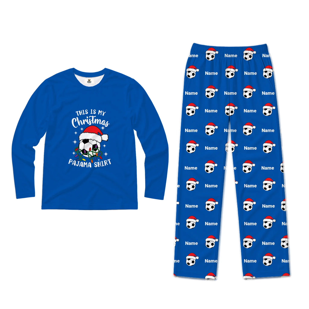A two-piece pajama set on a plain white background, featuring a royal blue long-sleeve shirt with a Christmas graphic and matching blue pants with a soccer ball and Santa hat pattern.