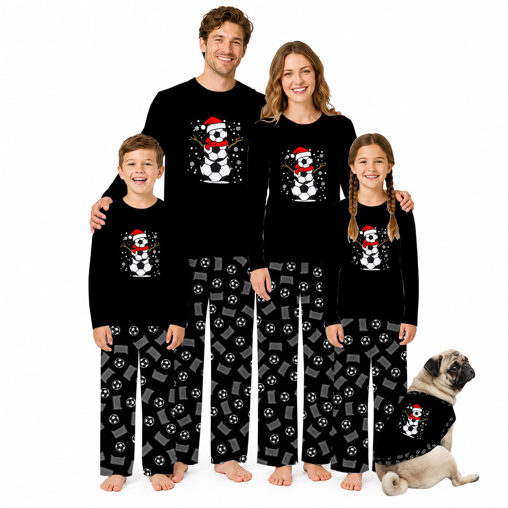 A family of four wearing matching black long-sleeve pajamas with a Santa-themed skull graphic and the name 'Alex' printed on the chest, standing against a white background. A small pug dog sits to the right wearing a matching pajama set.