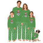 A family of four and a dog wearing matching green Christmas-themed pajamas with a snowman and soccer ball graphic on the chest, posed against a plain white background.