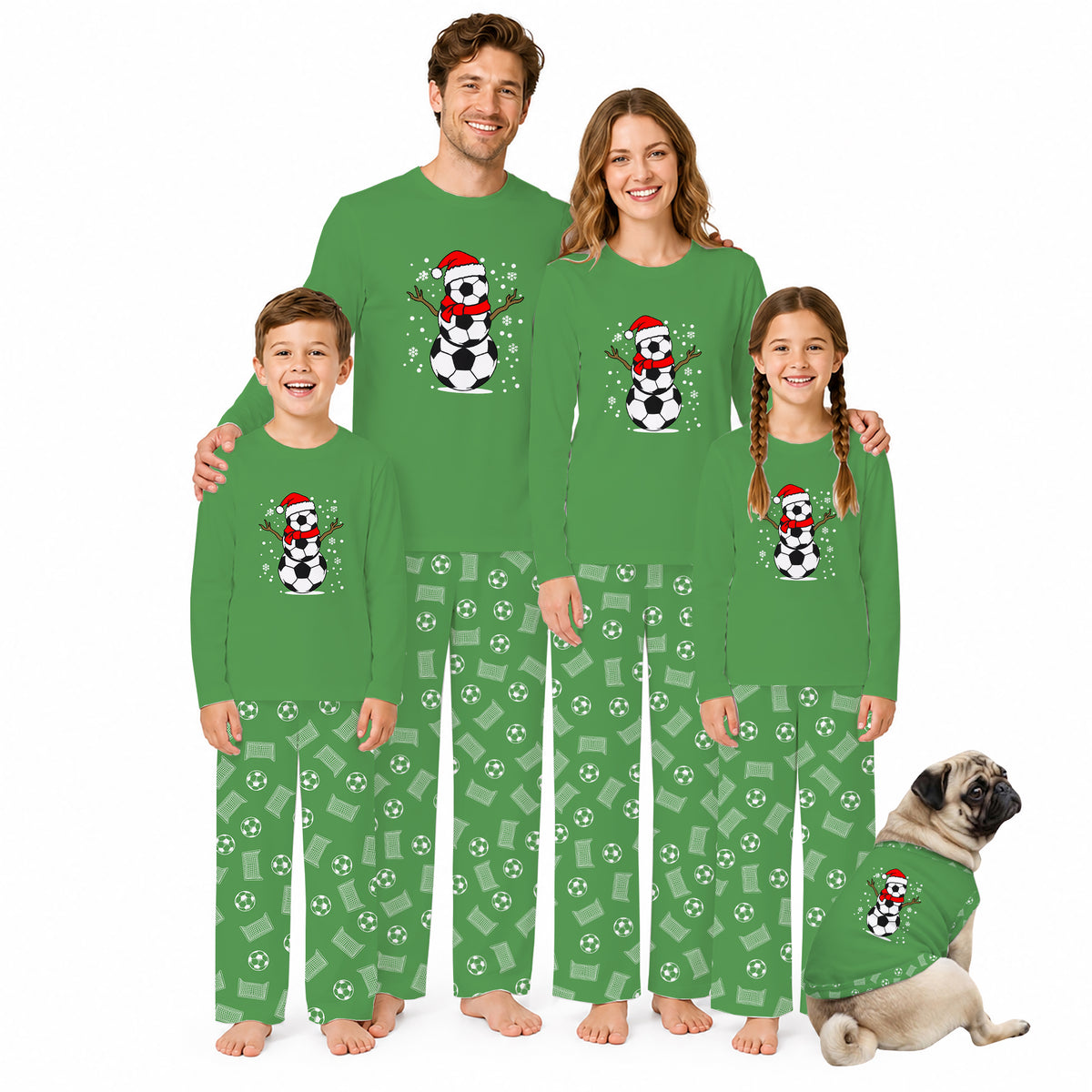 A family of four and a dog wearing matching green Christmas-themed pajamas with a snowman and soccer ball graphic on the chest, posed against a plain white background.