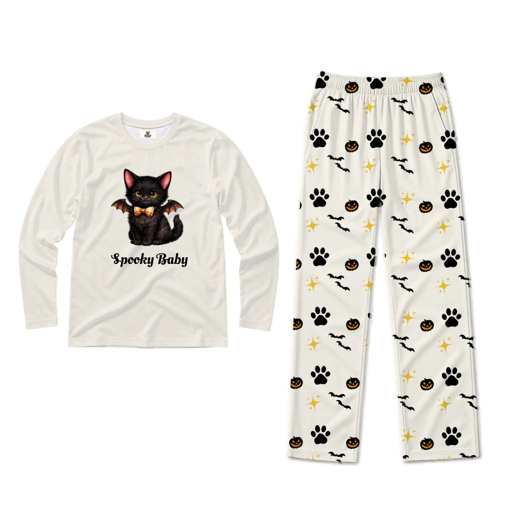 A two-piece Halloween pajama set on a white background. The long-sleeve shirt is off-white with a graphic of a black kitten with bat wings and the text 'Spooky Baby'.