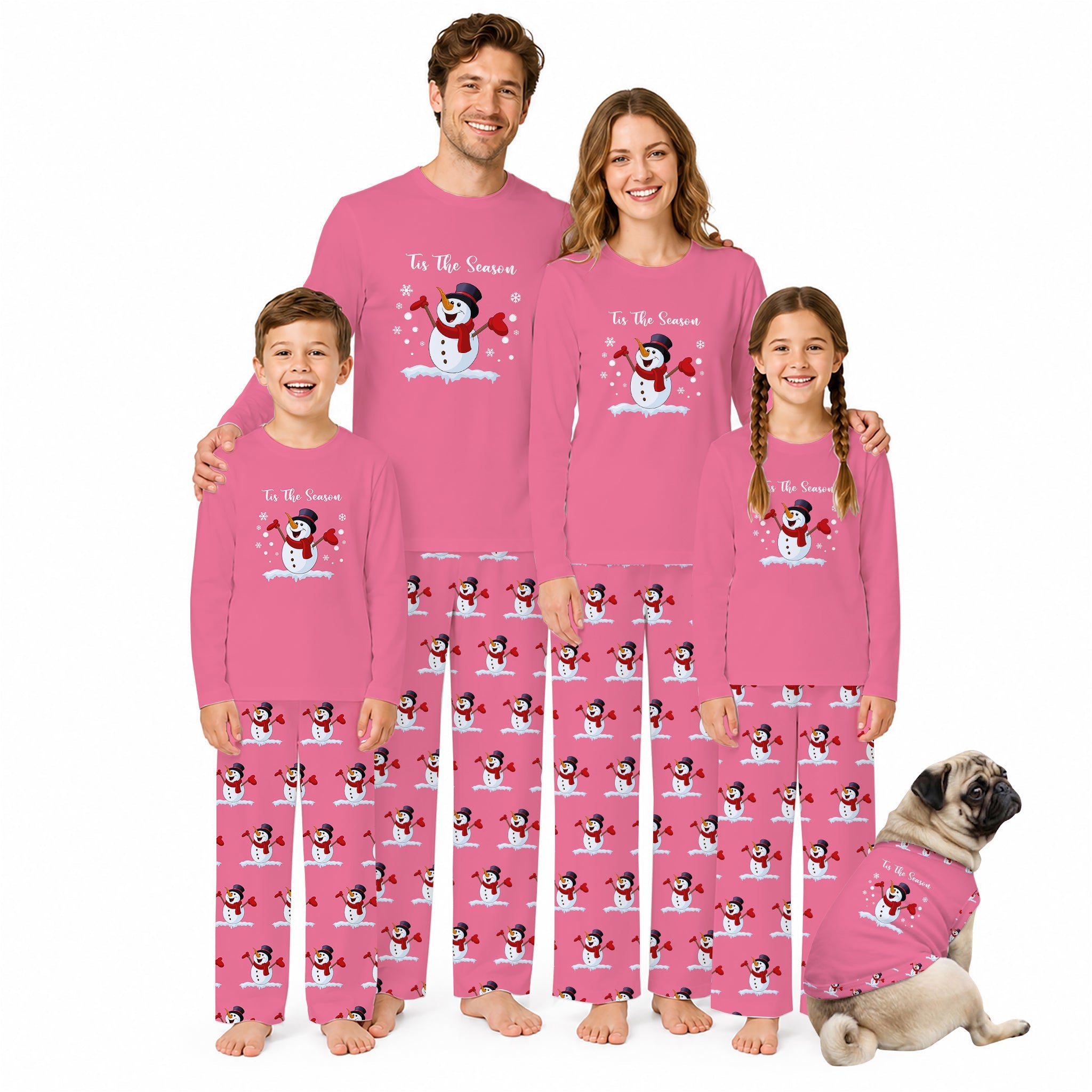 A family of four wearing matching Pink holiday pajamas with a snowman graphic and 'To The Snowman' text, standing against a White background, with a small pug dog wearing a matching pajama set beside them.