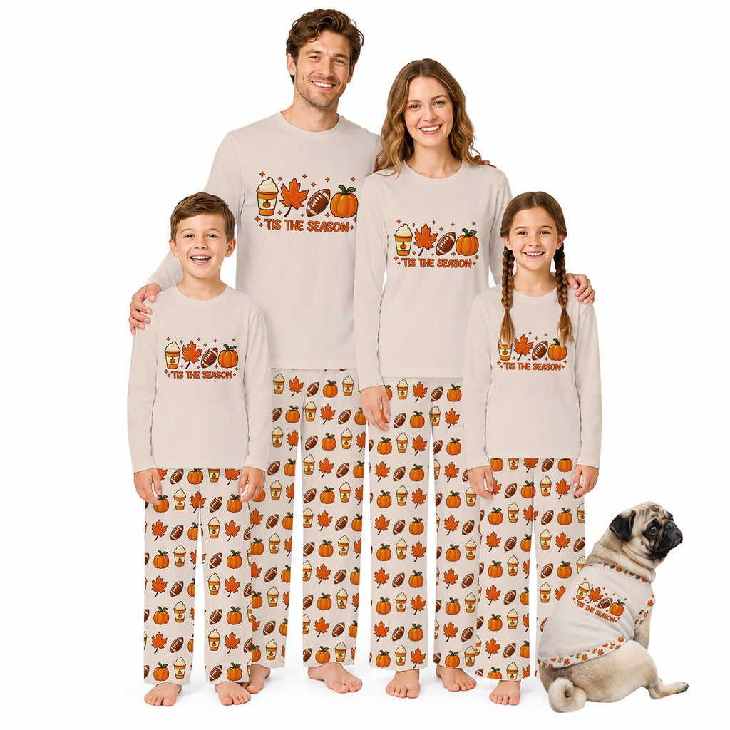 Four people and a small dog wearing matching Beige long-sleeve pajamas with a 'YES THE SEASON' autumn sports print and patterned pants, posed together on a White background.